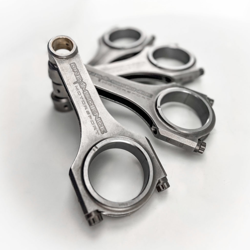The Image shows a set of four Dreamscience branded Connecting Rods in a rising spiral formation against a white background.